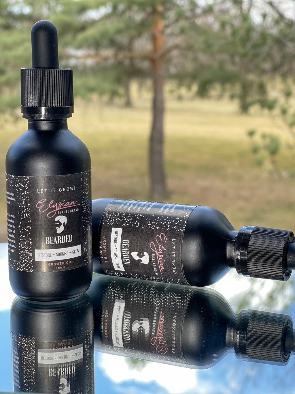 two black droppers of all natural hand made beard oil for men 